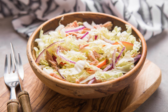 Healthy vegan diet salad with fresh vegetables - chinese cabbage, tuna, apple .Vegan food concept.
