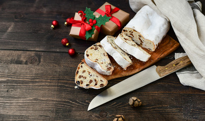 Christmas Stollen sliced on a wooden table. Christmas dessert. Recipe for Austrian and German cuisine. christmas in Europe