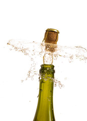 opening a bottle of champagne, cork flyes out of the bottle with splashes