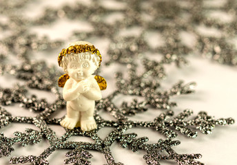 Christmas theme angel in Christmas nest with crystal gifts on snowflake.