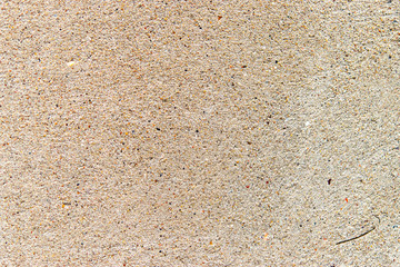 Textured sand plaster, close-up, abstract background.