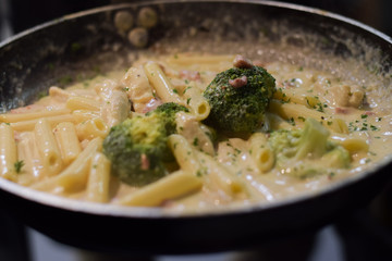 Hot brocolli penne pasta in the pan