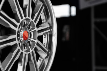 ar drives in the store with black background. Chrome car wheels for sale.