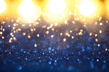 Christmas vintage lights background. Gold lights and blue glitter. defocused