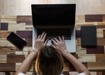 Woman's hands typing on laptop keyboard. Study and work online, freelance. Self employed or...