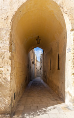 doorway to an tiny and narrow street in Mdina