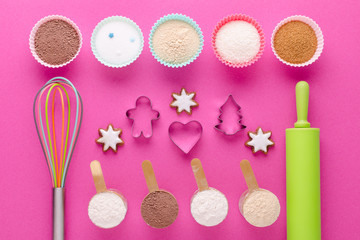 baking protein and another ingredients with kitchen tools and cookie cutter on pink background