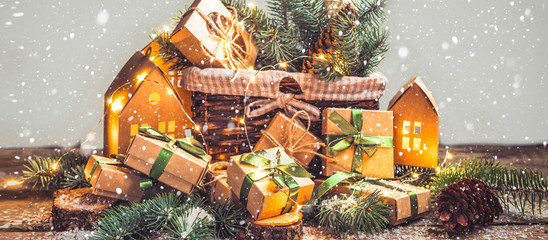 Christmas zero waste, eco friendly packaging. Festive Christmas composition packs gifts in kraft paper on a light table, eco Winter weekend concept, eco decor