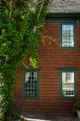 Fototapeta na wymiar Brown shingled facade of house