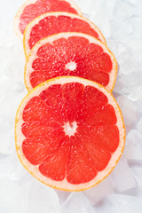  Grapefruit slices on ice. Close-up.