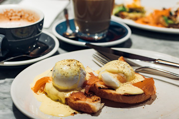 Poached eggs with smoked salmon on toast for brunch