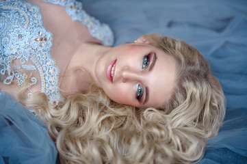 young beautiful russian blonde lies with beautiful hair