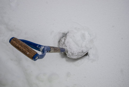 Shovel Buried In The Snow