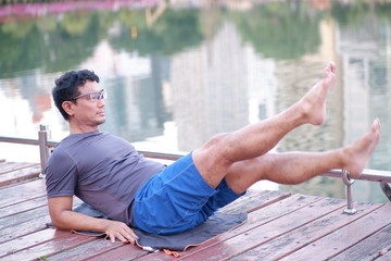 Asian Young Man Go Exercise in the park