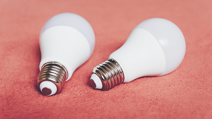 Light bulbs on a soft fluffy peach-colored background