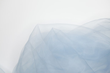 Blue lace fabric over white background