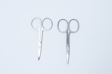  Iron small manicure scissors on a white background