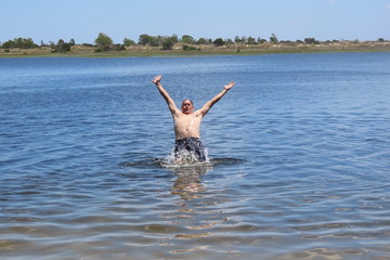 man jumping on the beach