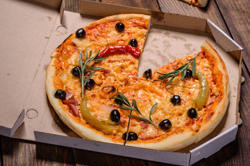 Tasty fresh hot pizza against a dark background. Pizza, food, vegetable, mushrooms