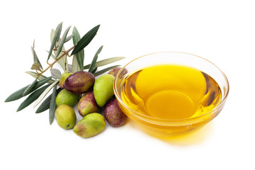 olive oil with olives isolated on white