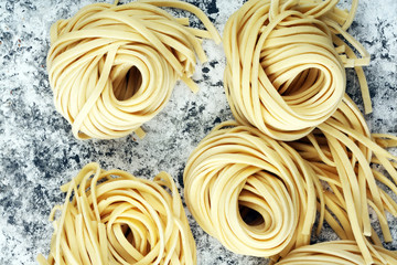 Closeup of raw homemade pasta. fresh italian traditional raw fresh pasta