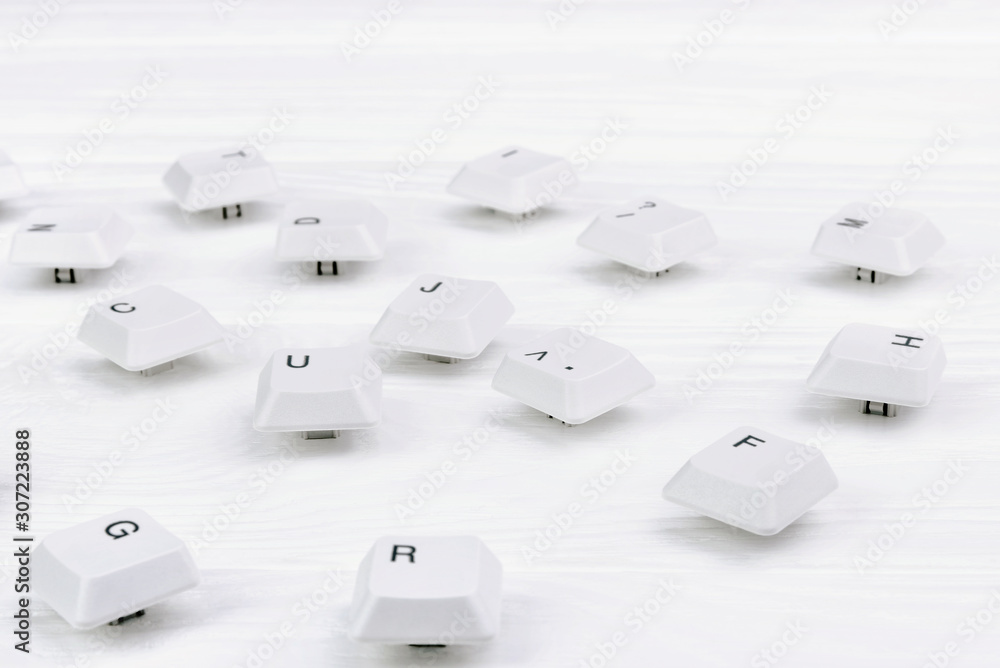 Fototapete keyboard keys isolated. white keyboard keys on white wooden background. top view. close up