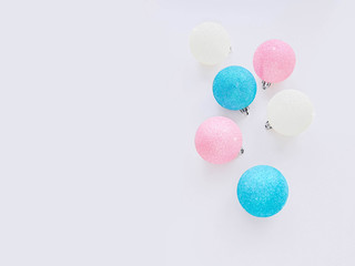 Decorative balls Top view photo with copy space Design template with shiny colorful baubles on light background