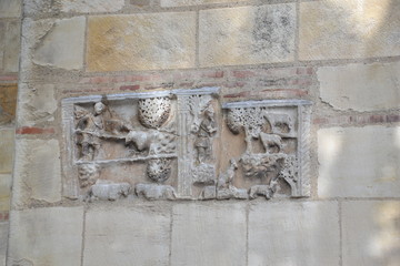 medieval stone bas-reliefs on the walls of the Basilica of Saint Sernin in Toulouse