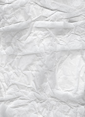 Crumpled paper. Light wrinkled wrapping paper for backgrounds. Portret format - Vertically located.