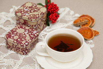 White cup of tea is on the table. Vintage. Retro. Horizontal.