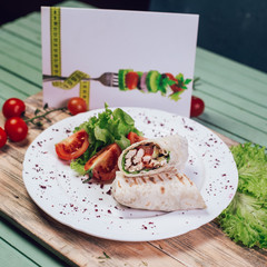 chicken doner with tomato, lettuce , cucumber