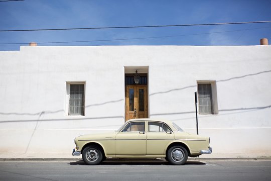 Parked Yellow Sedan