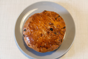 Traditional breton kouign des gras cake and knife on a dish