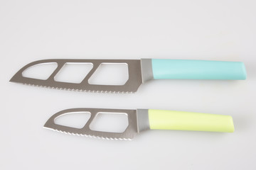 Real two kitchen knives of different colors shapes and sizes