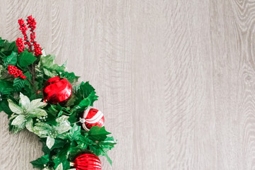 Christmas Wreath on Wooden Background - Left Lower Corner