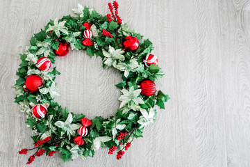 Fototapeta na wymiar Christmas Wreath on Wooden Background - Left - Variation 2