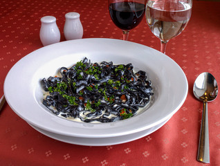Pasta with cuttlefish ink and parsley