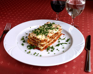 Lasagne sprinkled with parsley in the restaurant
