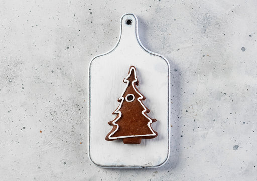 Decorated gingerbread christmas tree on a wooden board