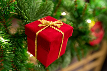 Closeup of christmas tree with balls and light.