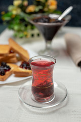 tasty blackberry jam, tea  and toast on the table