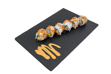 High angle shot of tasty delicious sushi rolls on a black surface