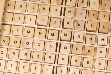 Alphabet letters written on wooden cubes for children education