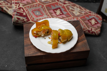 green tomato pickle with wooden background