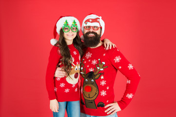 Be positive. santa man and kid ready for party. love and joy. father and daughter celebrate xmas. little girl with dad red background. happy new year. enjoy family holiday together. merry christmas