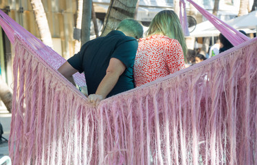 couple sitting in a hammock