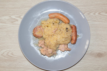 Traditional dish from Alsace, sauerkraut with meat in a plate