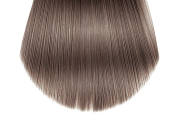 Brown hair close-up on white background, isolated. Carefully trimmed tips
