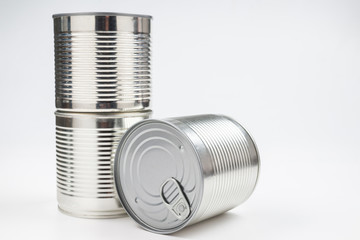 Group of silver canned food on white background.