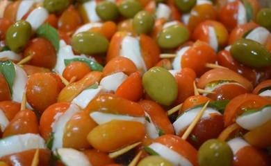 appetizers with tomatoes, cheese, olives and basil